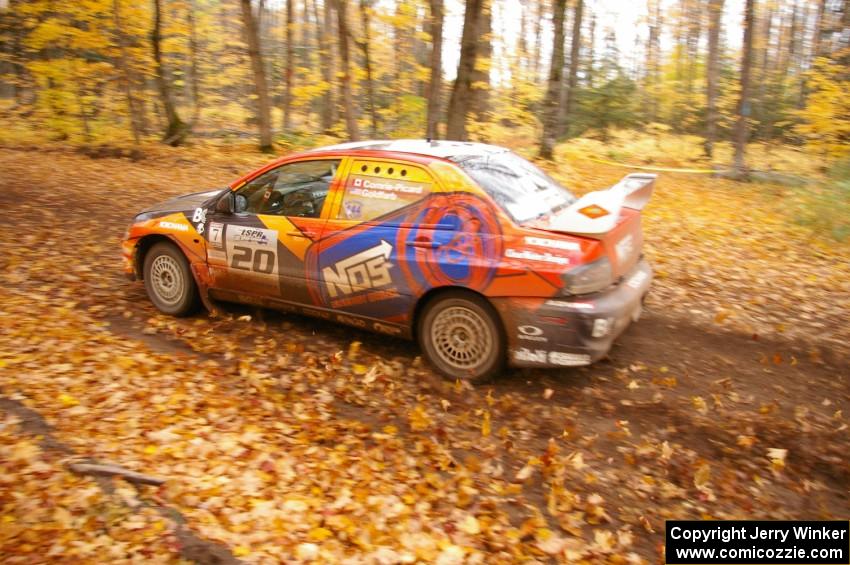 The Andrew Comrie-Picard / Marc Goldfarb Mitsubishi Lancer Evo 9 RS drifts through a sweeper near the finish of SS2.