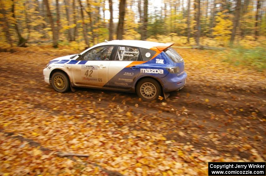 Eric Burmeister / Dave Shindle drift their Mazda Speed 3 through a sweeper on SS2, Beacon Hill.