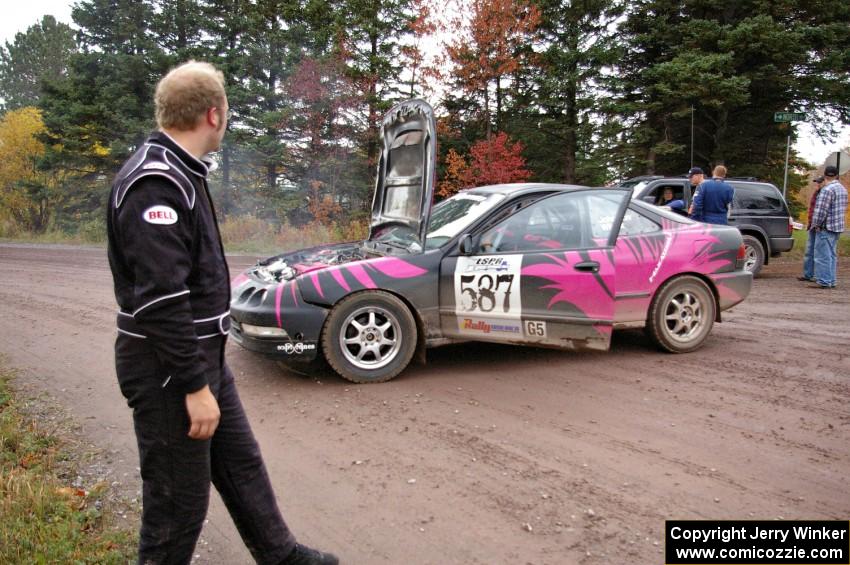 Matt Johnston eyes the smoking engine of the Acura Integra he Luke Wilcox worked so hard to get running prior to the event.