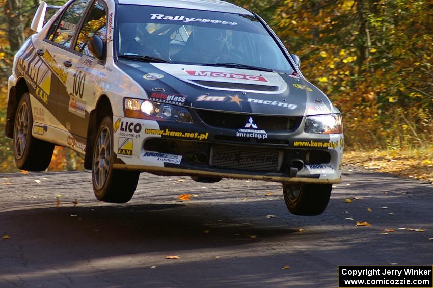 The Andi Mancin / Maciej Wislawski Mitsubishi Evo 9 catches air midway on Brockway 1, SS13.