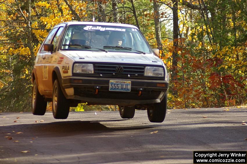 Michel Hoche-Mong / Jimmy Brandt catch nice air at the midpoint jump on Brockway 1, SS13, in their VW GTI.