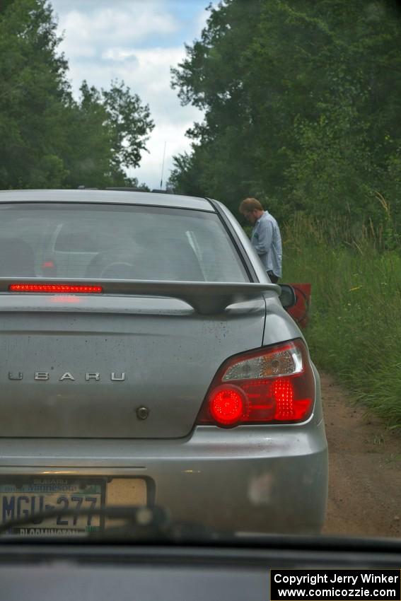 Ben Slocum was in charge of the start of SS1 and chats with the line of marshals as they head into the forest.