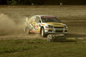 Andi Mancin / Maciej Wislawski drifts his Mitsubishi Lancer Evo 9 sideways on a corner on SS1.