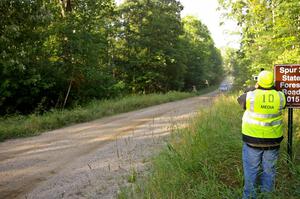 Journalist Bill Wood films the oncoming Dave Mirra / Derek Ringer Subaru WRX STi on SS2.