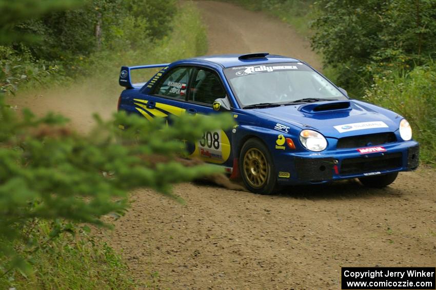 Janusz Topor / Michal Kaminski set up for a left-hander on the practice stage in their Subaru WRX STi.