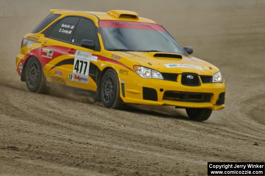 Don Conley / Chris Herlache drift on the high bank in their Subaru WRX Wagon on SS1.