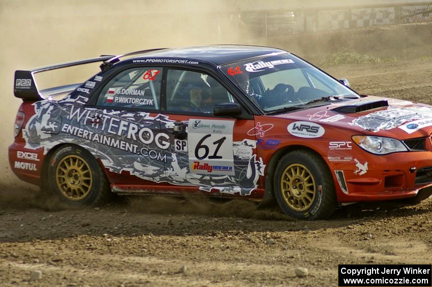 The Piotr Wiktorczyk / Grzegorz Dorman Subaru WRX STi powers through a corner on SS1.