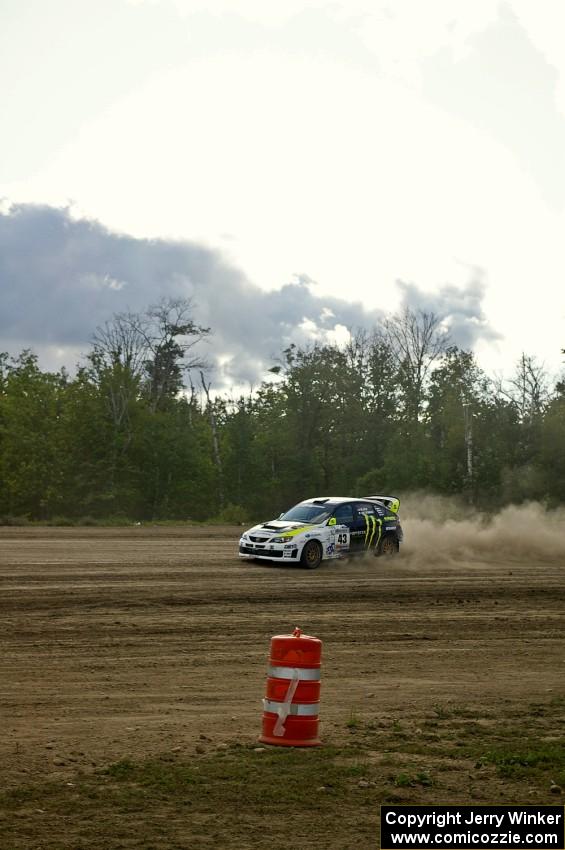 Ken Block / Alex Gelsomino set up for a hard left hander in their Subaru Impreza WRX STi on SS1.