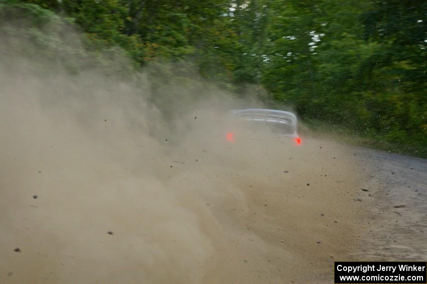 Travis Pastrana / Christian Edstrom drift their Subaru WRX STi through a fast left-hander on SS2.