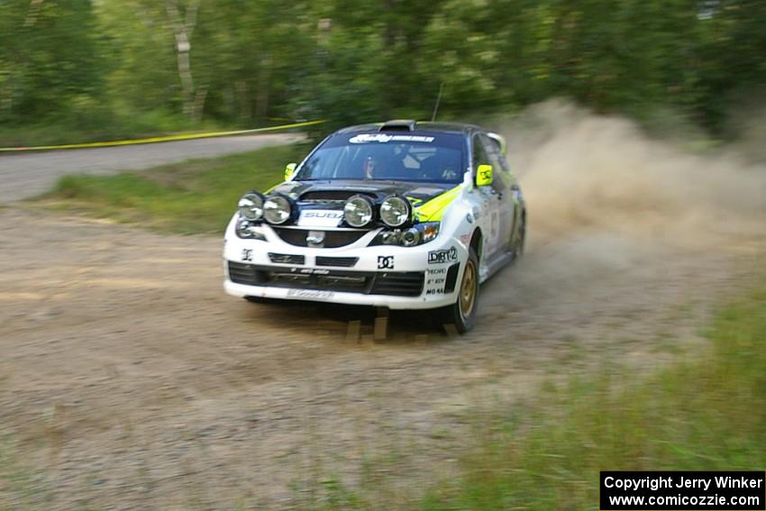 Ken Block / Alex Gelsomino through a fast left hander on SS2 in their Subaru Impreza WRX STi. They DNF'ed after a roll on SS3.