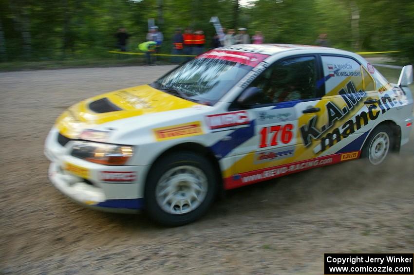 The Andi Mancin / Maciej Wislawski Mitsubishi Lancer Evo 9 at sped on a left-hander on SS2.