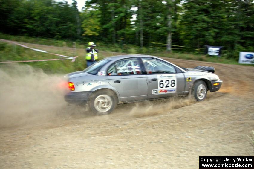 Dan Adamson / Jeremiah Schubitzke take to uphill hairpin on SS4 in their Saturn SL2.