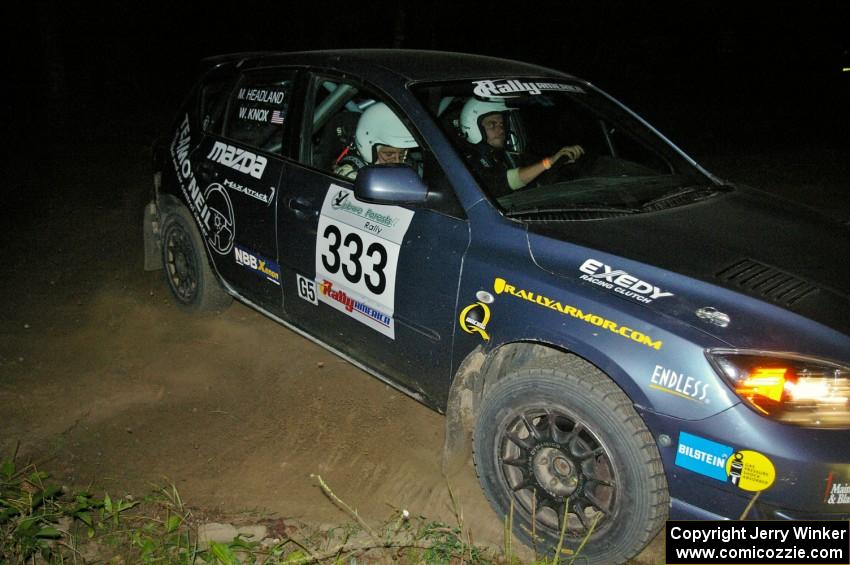 Wyatt Knox / Martin Headland fly through a 90-right on SS6 in their Mazda Speed 3.