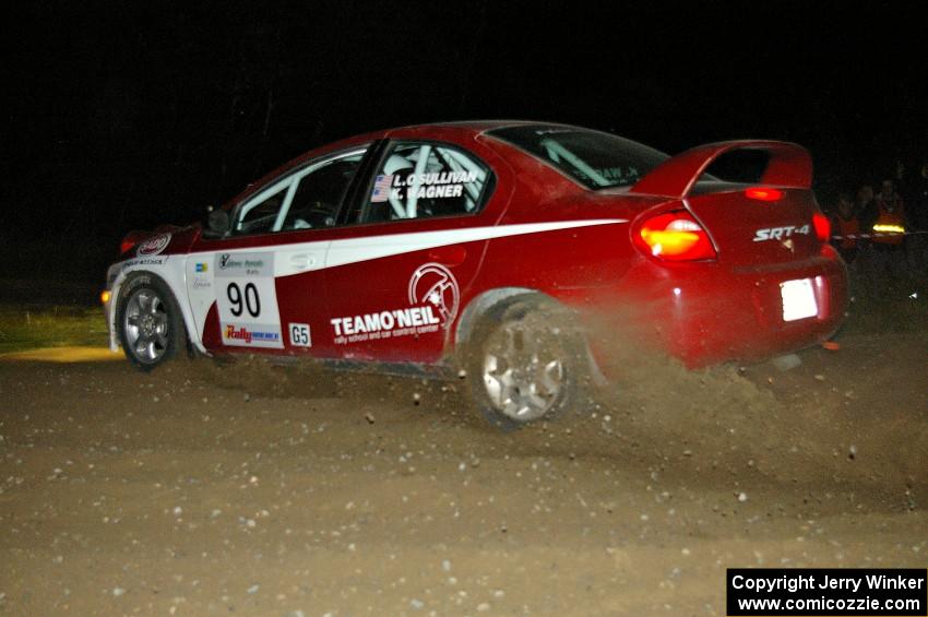 Lauchlin O'Sullivan / Karen Wagner drift their Dodge SRT-4 at the downhill hairpin on SS7.