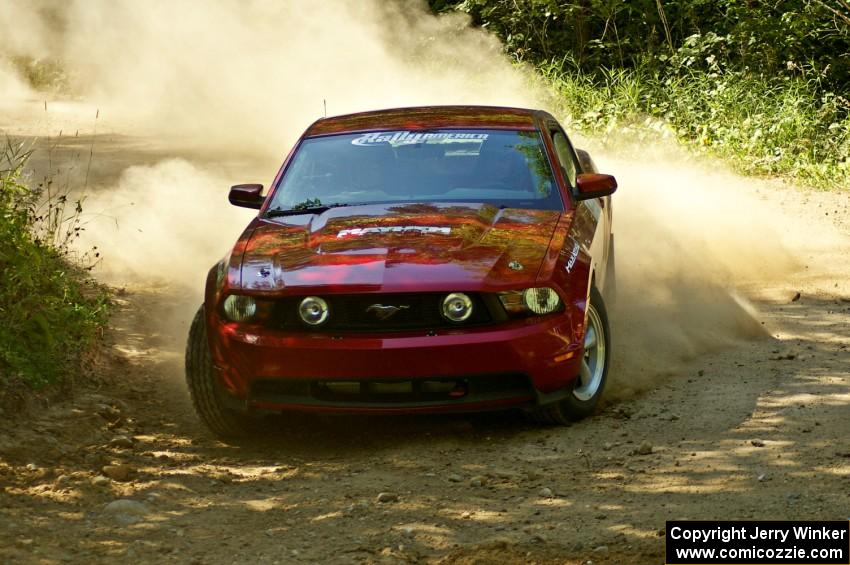 Mark Utecht / Rob Bohn drift the car through a right-hander on SS11, Indian Creek, in their Ford Mustang.