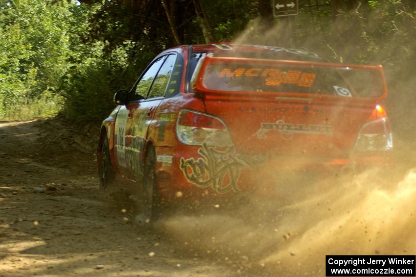 Nate Conley / Adam Kneipp set up nicely for the uphill 90-right on SS11 in their Subaru WRX STi.