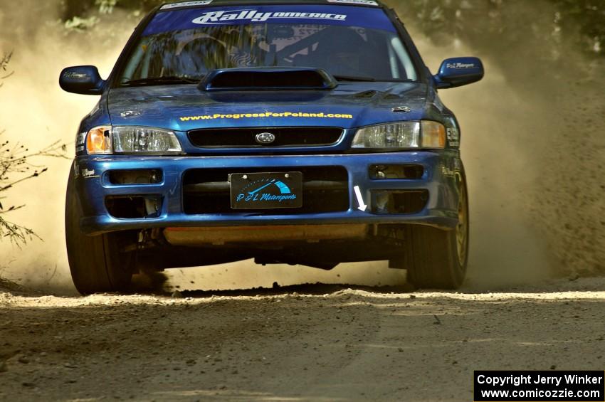 Piotr Fetela / Mariusz Malik scream out of a corner on SS11 in their Subaru Impreza.