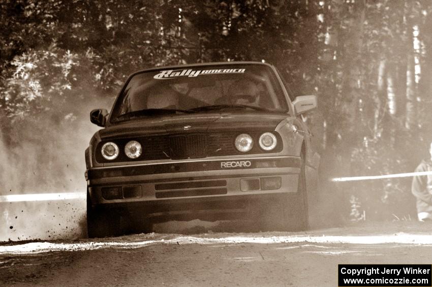 Bill Caswell / Damen Williams take their BMW 318i through a right hander on SS11.