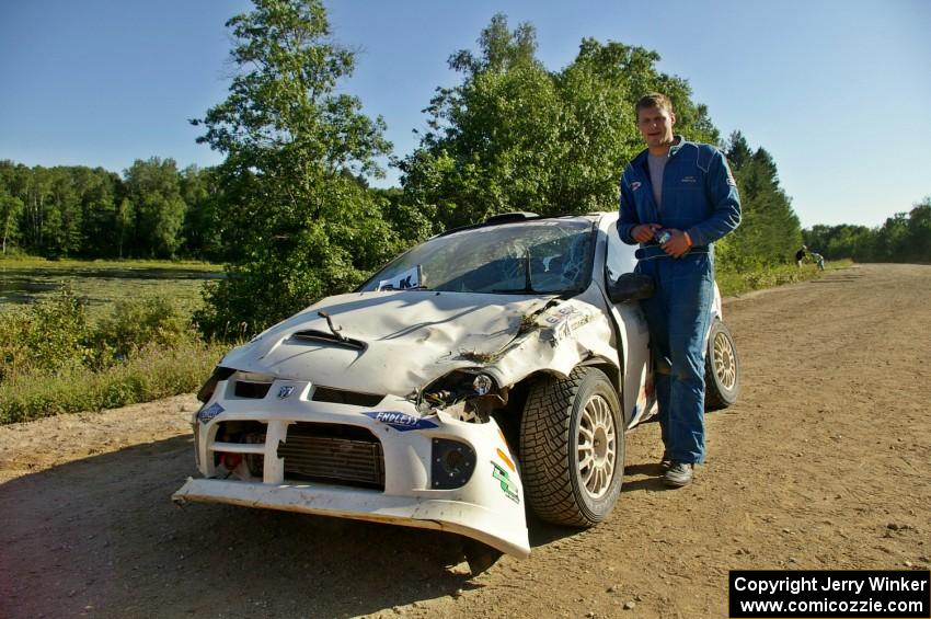 Zach Babcock stands in front of the Dodge SRT-4 he and Jack Penley rolled hard on SS11.(1)