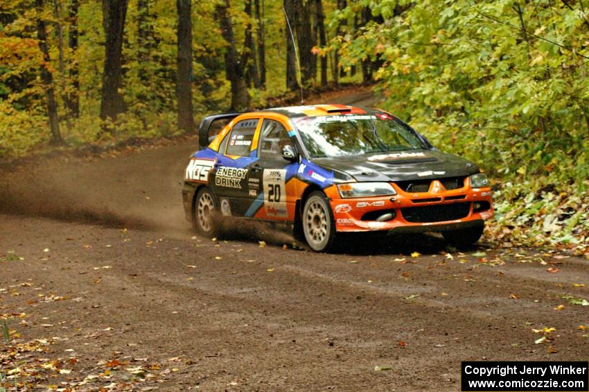 Andrew Comrie-Picard / Jeremy Wimpey drift their Mitsubishi Lancer Evo 9 through one of the last corners of Beacon Hill, SS2.