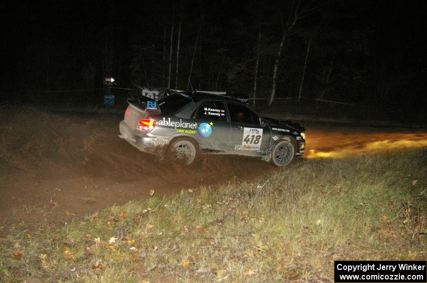 Jimmy Keeney / Missy Keeney at speed through the spectator corner on Far Point 2, SS7, in their Subaru WRX STi.