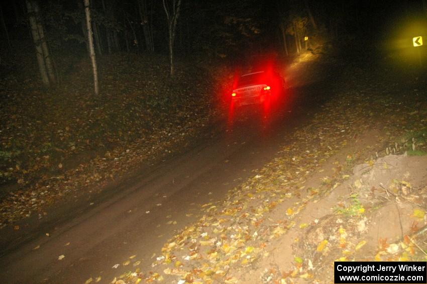 Arkadiusz Gruszka / Lukasz Wronski head downhill into a fast sweeper on Menge Creek, SS9, in their Mitsubishi Lancer Evo 9.