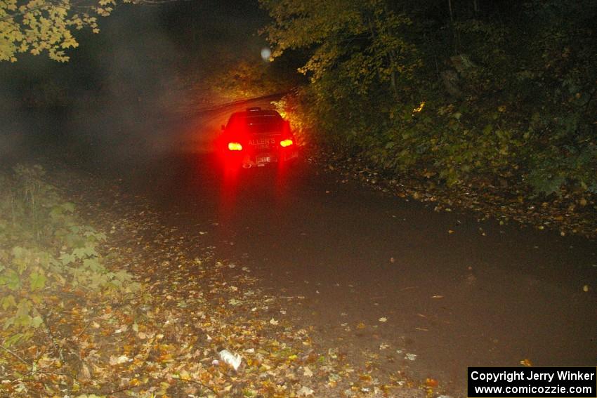 Vio Dobasu / Rob Amato head downhill on Menge Creek, SS9, in their Subaru WRX STi.