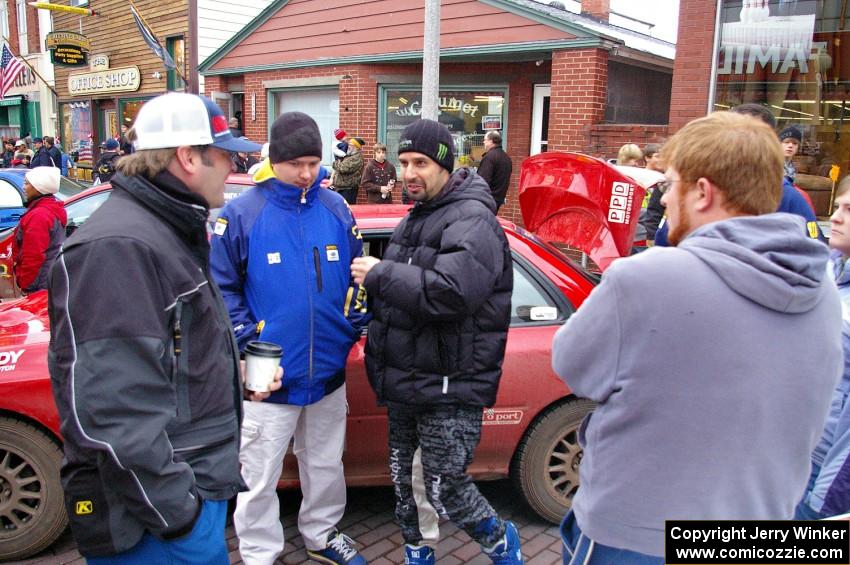 Mark Williams, unknown, Alex Gelsomino and Ben Slocum converse at Saturday morning's parc expose.