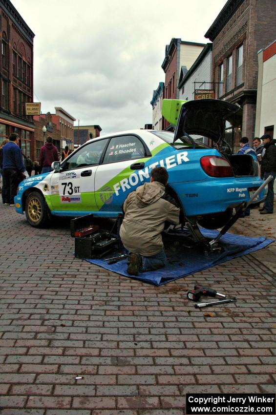 The Pete Hascher / Scott Rhoades Subaru WRX gets last minute repairs at Saturday morning's parc expose.