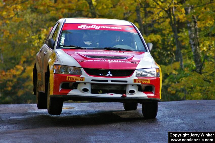 Arkadiusz Gruszka / Lukasz Wronski catch air at the midpoint jump on Brockway Mtn. 1, SS13, in their Mitsubishi Lancer Evo 9.