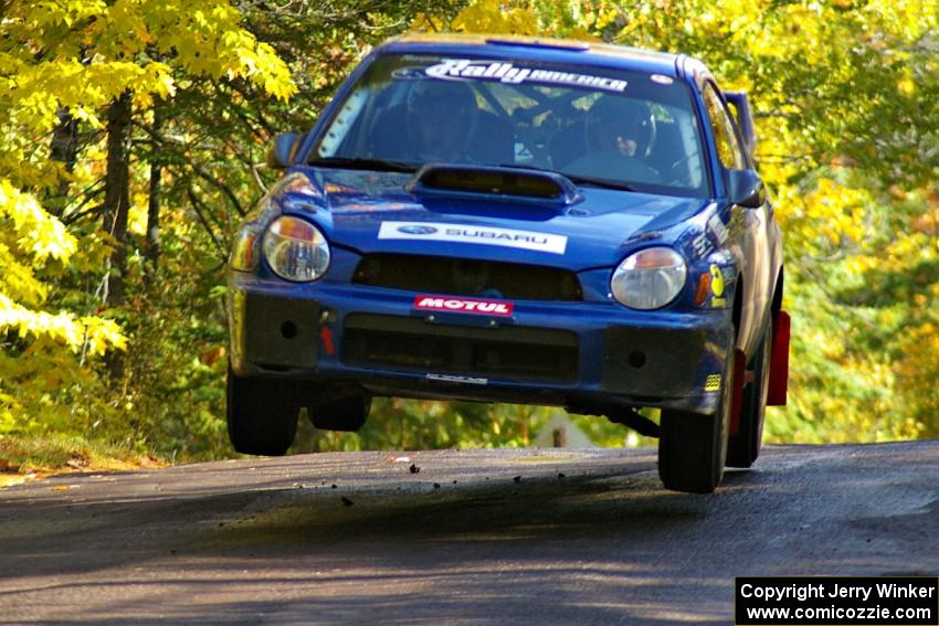 The Janusz Topor / Michal Kaminski Subaru WRX STi catches air at the midpoint jump on Brockway Mtn. 1, SS13.