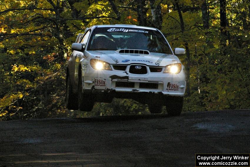 Heath Nunnemacher / Mike Rossey catch nice air at the midpoint jump on Brockway Mtn. 2, SS16, in their Subaru WRX STi.