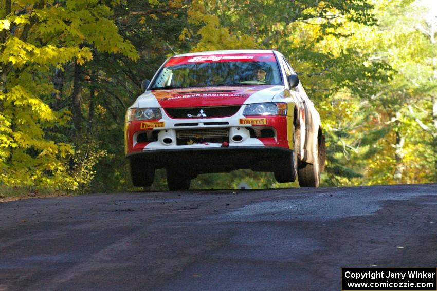 Arkadiusz Gruszka / Lukasz Wronski get nice air at the midpoint jump on Brockway Mtn. 2, SS16, in their Mitsubishi Lancer Evo 9.