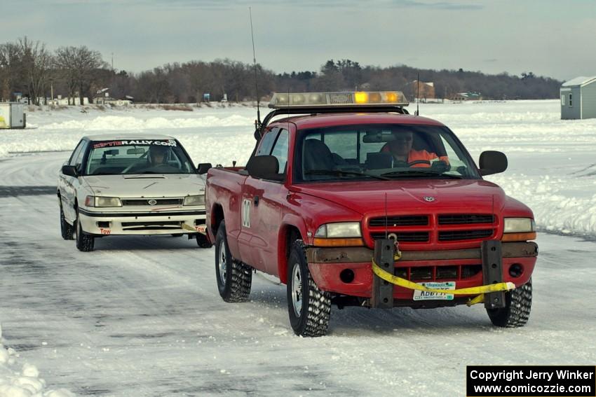 The Carl Siegler / David Goodman / Dan Drury Subaru Legacy is towed into the pits.