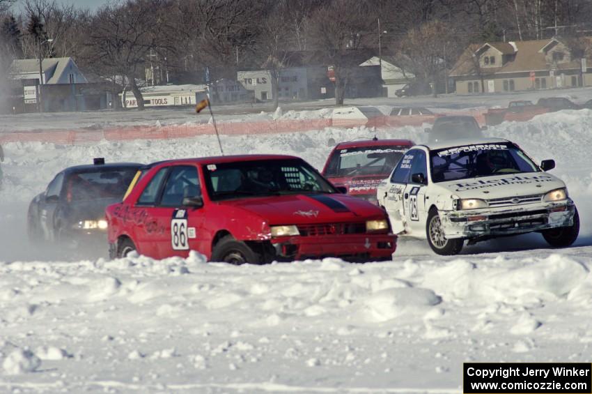 Four cars head out of corner two.