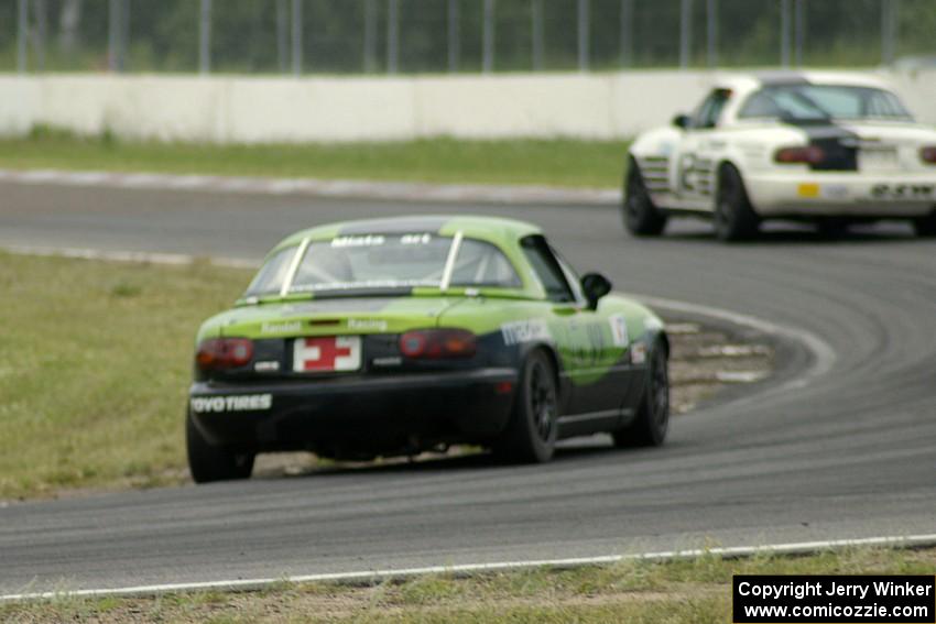 Jamey Randall's Spec Miata Mazda Miata chases Ray Yergler's ITA Mazda Miata