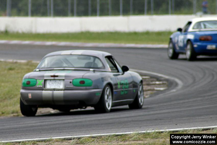 Joe Swearingen's Spec Miata Mazda Miata chases Greg Blaser's Spec Miata Mazda Miata