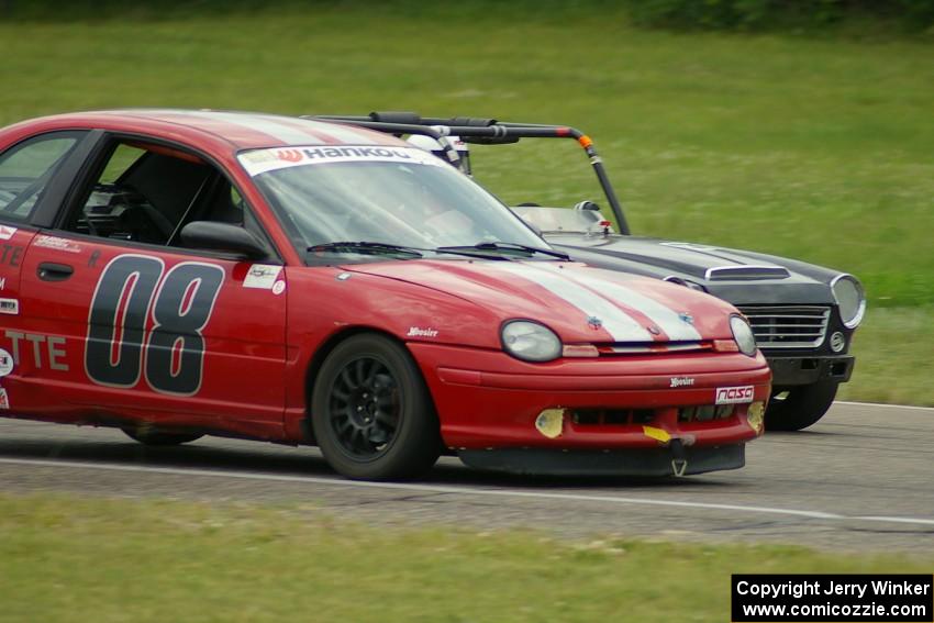 Zane Emstad's F Production Datsun SPL311 ducks inside Aaron Jongbloedt's ITA Dodge Neon ACR