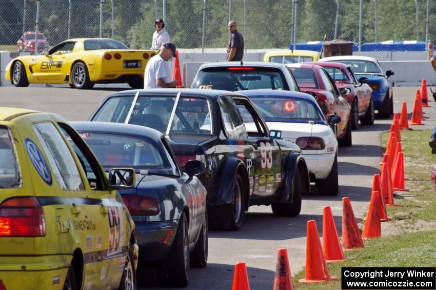 Group 1 cars lined up on the false grid before the start of the race