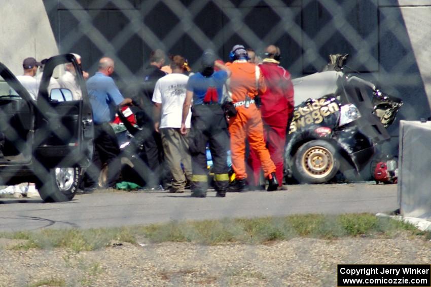 Steve Hendricks is freed from his wrecked SSC VW Rabbit