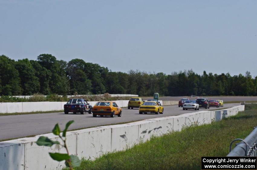 Race group 1 comes down the front straight into turn one.