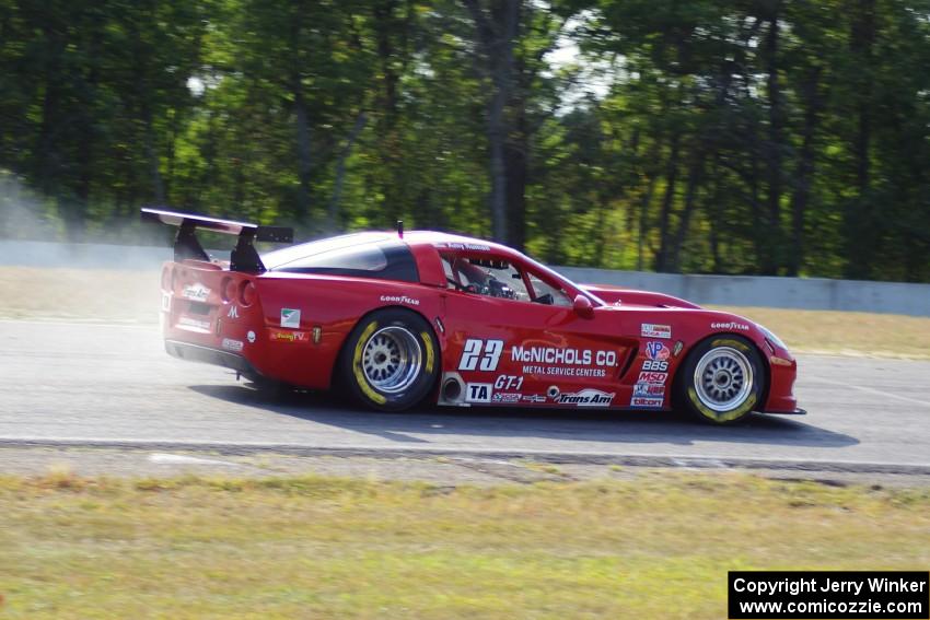 Amy Ruman's Chevy Corvette locks up the brakes at turn three.