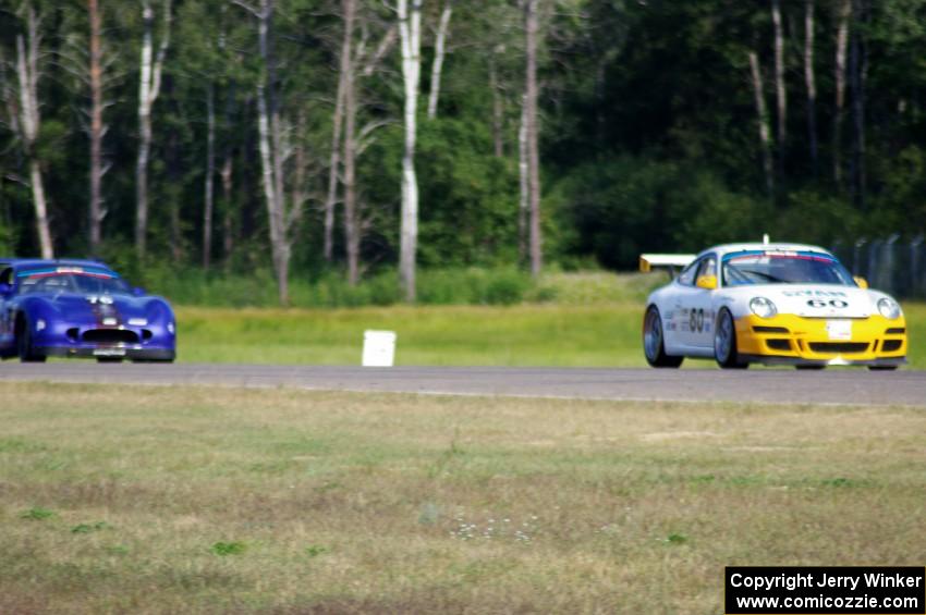 Tim Gray's Porsche GT3 Cup and Chuck Cassaro's Panoz GTS battle in GGS.