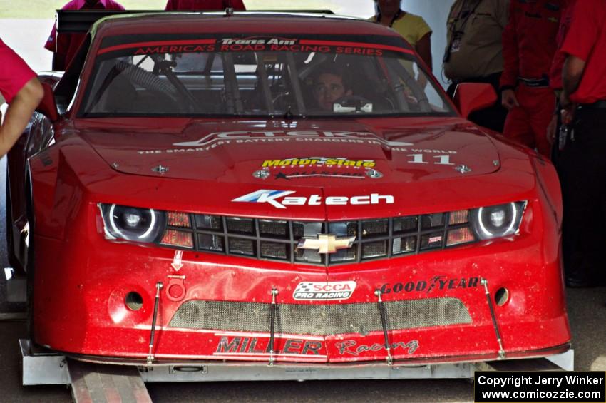 Cameron Lawrence's Chevy Camaro is weighed after the race on Saturday.