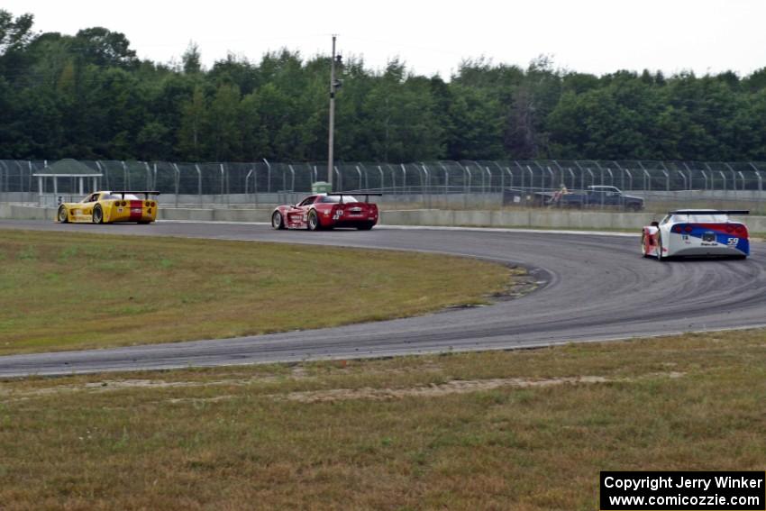 Amy Ruman's Chevy Corvette holds off Simon Gregg's Chevy Corvette at turn 4 with two laps to go.