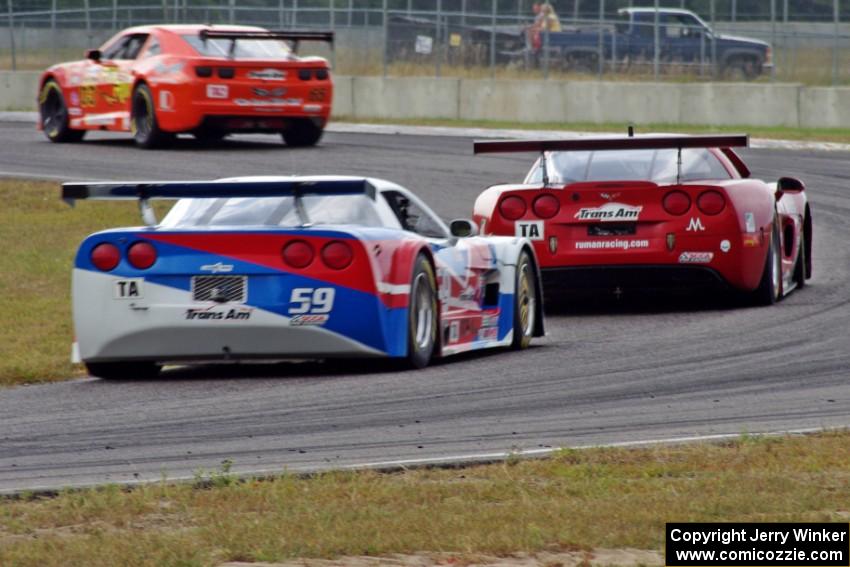 Amy Ruman's Chevy Corvette holds off Simon Gregg's Chevy Corvette at turn 4 on the last lap.