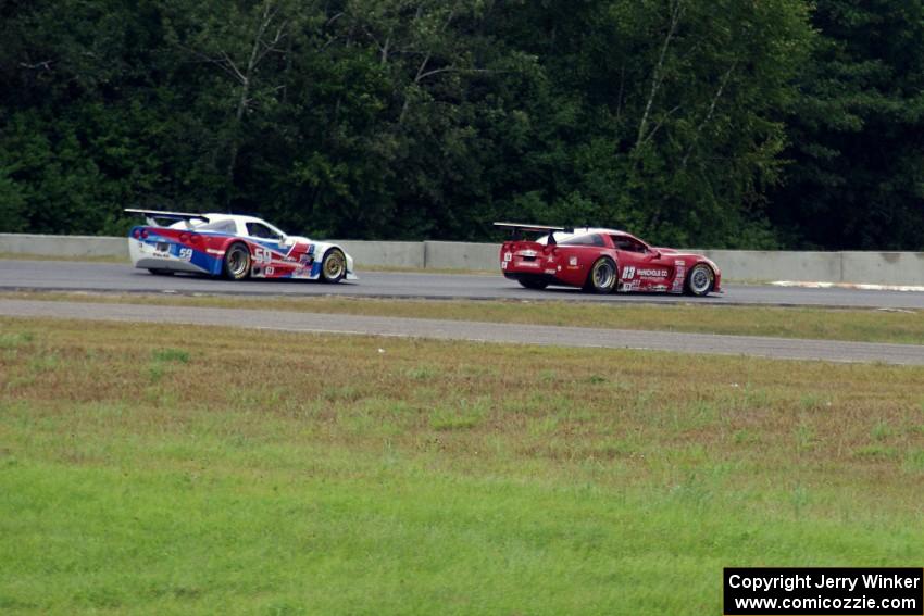 Amy Ruman's Chevy Corvette holds off Simon Gregg's Chevy Corvette at turn 5 on the last lap.