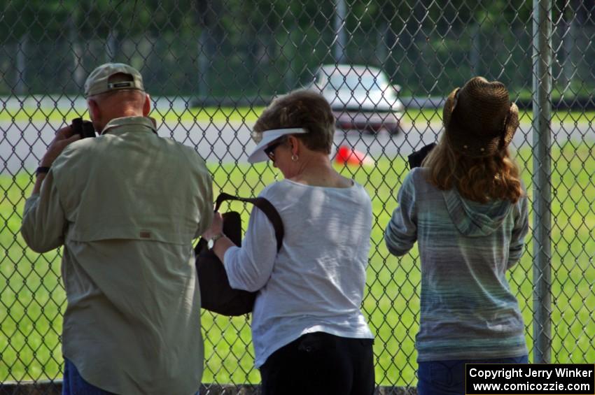 Spectators at the carousel fence