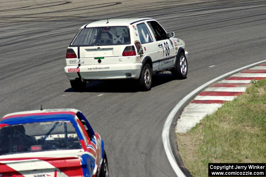 JAB Motorsport VW GTI and British American Racing BMW 318i