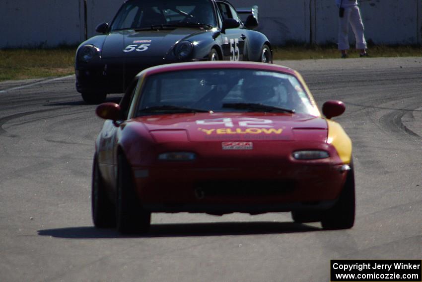 Greg Youngdahl's ITA Mazda Miata followed by Phil Magney's ITE-2 Porsche 993